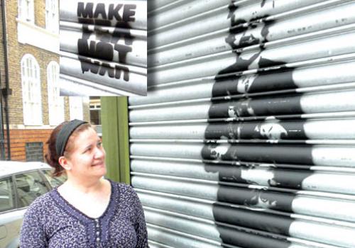 Loretta Aslan admires the image of June Beechey that appeared on her café’s shut