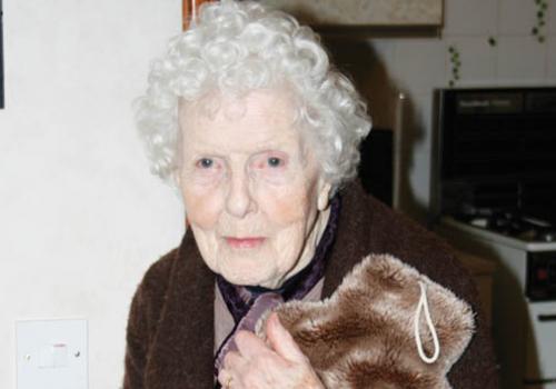  Elsie Garrison, 92, with hot water bottle. 