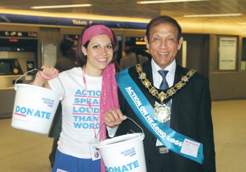 Camden Mayor Abdul Quadir rattles a collection bucket at King’s Cross station