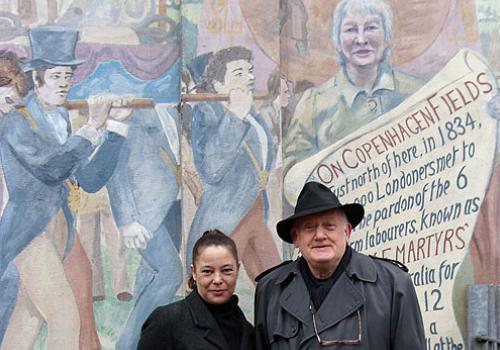 Sophie Talbot and Rob Inglis in front of the mural depicting Lisa Pontecorvo