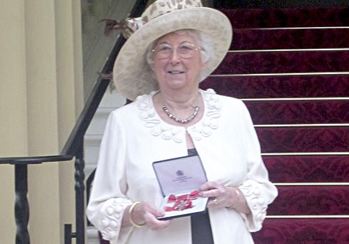 ‘Perfect neighbour’ Dolly Wren with her MBE at Buckingham Palace