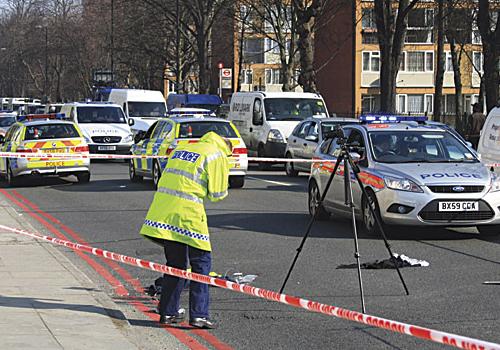 Police at the scene of  the accident during the morning rush-hour