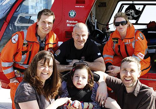 Ruby flanked by her parents and the on-duty LAA crew