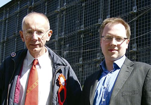 Cllr Barry Edwards and Cllr Richard Watts in front of the wall in Paradise Park 