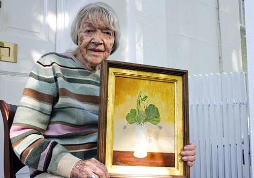 Anne Cloudsley with one of her paintings