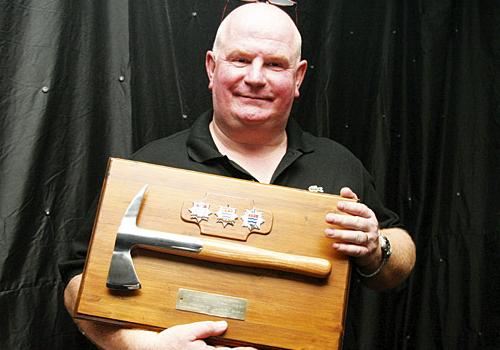 George Banks with a traditional fireman’s axe. Photo: Paul Wood