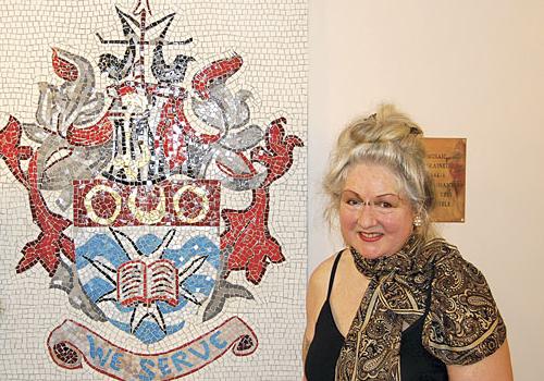 Juliet Webster and the mosaic coat of arms