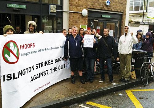 Protesters outside the offices of Atos