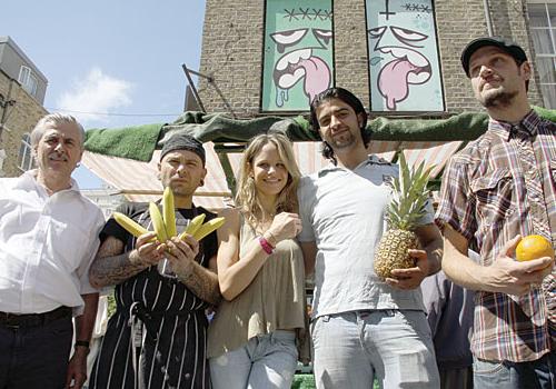 Artist Mr E Dawe (far right), who is participating in the event, with traders