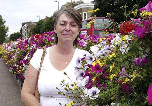 Councillor Tracy Ismail with the floral displays in Holloway Road