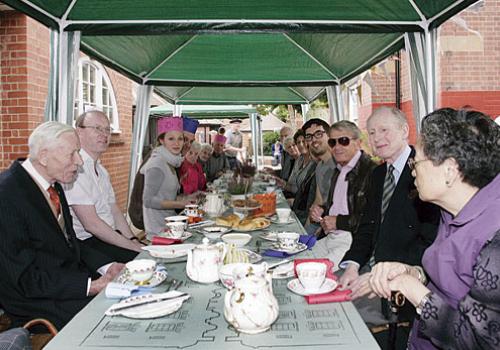 Residents enjoy tea and cakes at the VE Day re-creation event