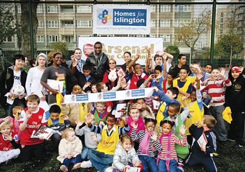 Johan Djourou with youngsters at King Square estate