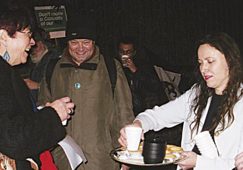 Oriel Hutchinson serves up mulled wine to disappointed protesters