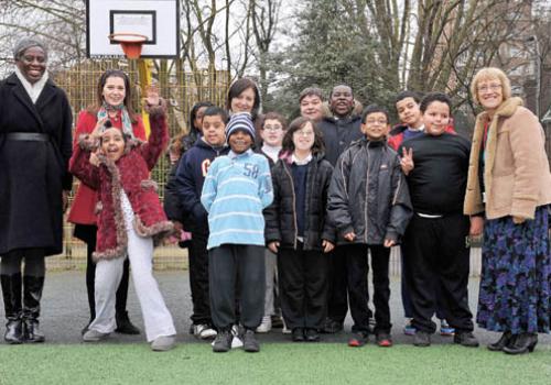  Baroness Young and Baroness Henig are pictured with children at Swiss Cottage S