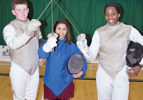 Councillor Tulip Siddiq at Swiss Cottage Leisure Centre with fencers Alex Beardm