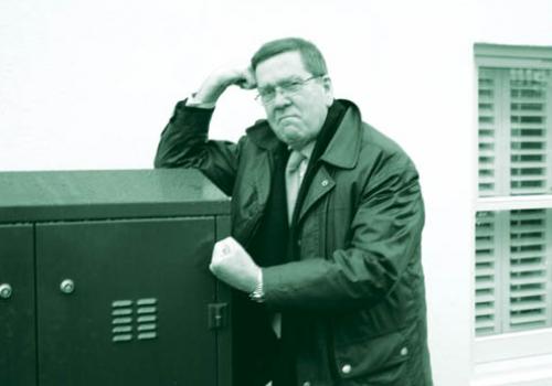 Cllr Chris Knight with one of the offending phone cabinets