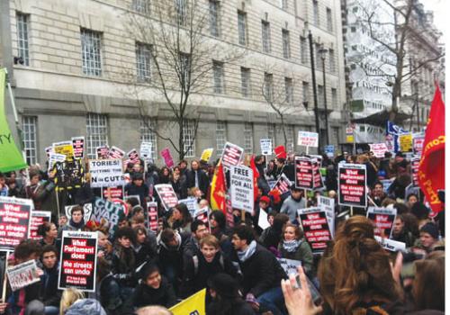  Protesters stage a sit-down in Millbank, near Tory party HQ.