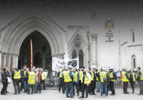 Members of No To Bike Parking Tax make their point outside the Royal Courts of J