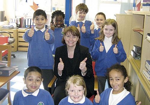 Carlton Primary School headteacher Jacquie Phelan celebrates with her pupils