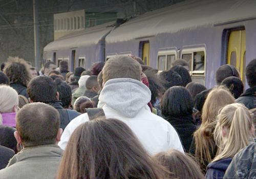 Passengers struggle to board a train at Gospel Oak