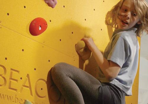 A youngster becomes one of the first to use the climbing wall at Seymour Leisure