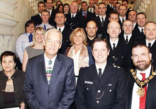 Jon Snow,  John Sutherland and Jonathan Simpson with police officers 