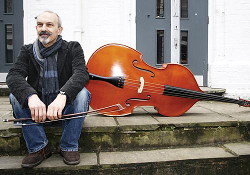 Actor Christopher Hunter with the double bass he has borrowed