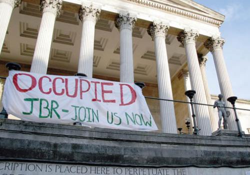 A banner outside UCL during December’s action