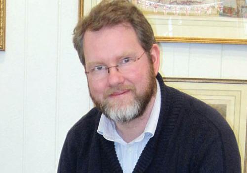 Tim Bryars at his shop  in Cecil Court