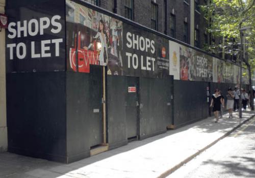 The advertising hoarding inviting new businesses to Store Street