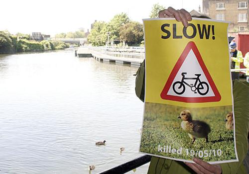 Sonja Curtis with a sign she made herself to warn cyclists