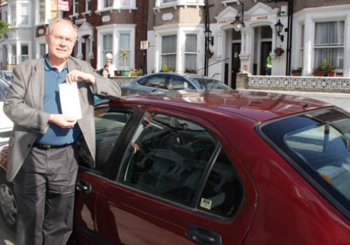 Councillor Keith Moffitt with his parking ticket  