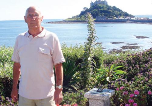 Brian Ivory at his Cornwall home with St Michael’s Mount in the background