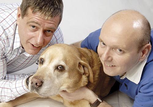 Martin Davies with his long-term partner Richard Boaste and their dog Benson