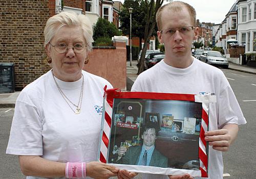 Pam McInally and her nephew Warwick Goodall with a picture of Stuart