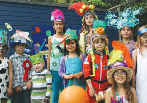 Pupils in home-made headgear.