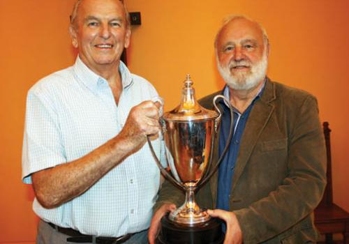 Alan Dallman receives a trophy from MP Frank Dobson