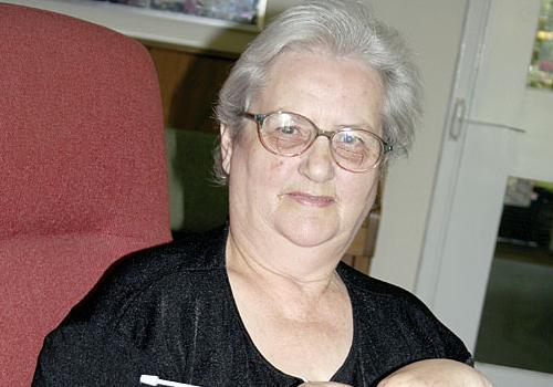 Rosebush Court resident Pauline Charman knits a blanket