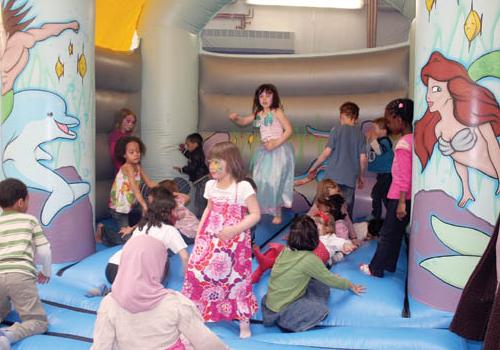 Children enjoy the bouncy castle at Bedford Community centre