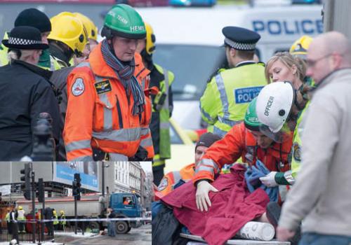 Paramedics, police and air ambulance staff free the woman from under the lorry o