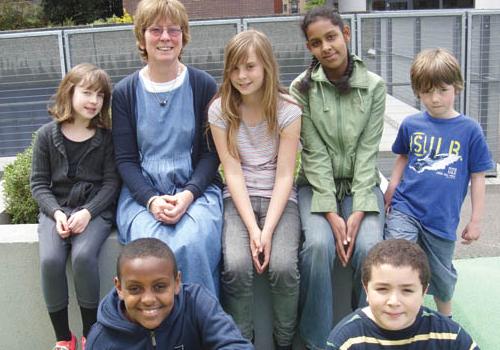 Headteacher Mary Caven with some of her pupils at Prior Weston