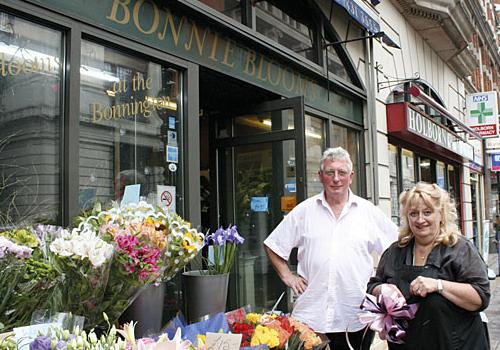 Tommy and Annette Sacker outside their shop in Southampton Row