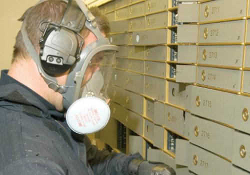 Police officers open safe deposit boxes during Operation Rize in 2009