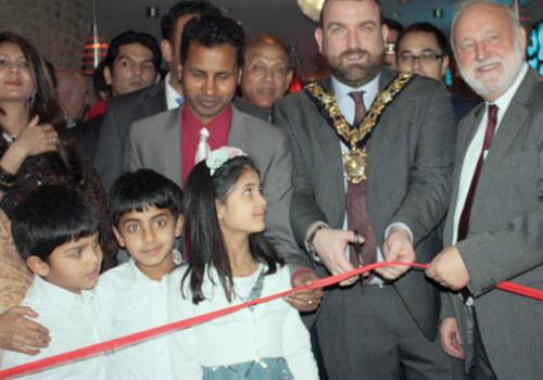 Mayor Jonathan Simpson, Cllr Ali and MP Frank Dobson cut the tape