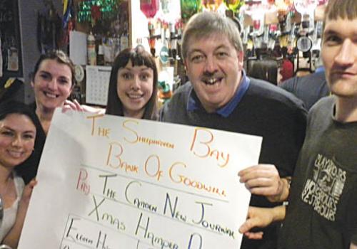 Pat Logue at the Sheephaven Bay pub with the generous cheque