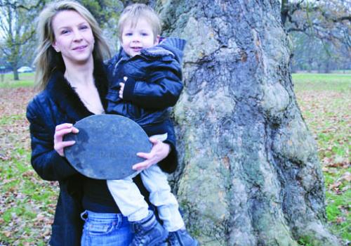 Yuri Ouvarov’s daughter Alla, with her son, inspect the plaque