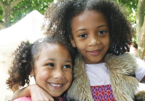 Ayza Jews, five,  and Esee Deen-Carter, nine, enjoy  the fair