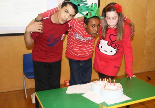 Frank Barnes pupils Hussain El-Shemery, Abdi Hassan and Georgina Drinnan blow ou