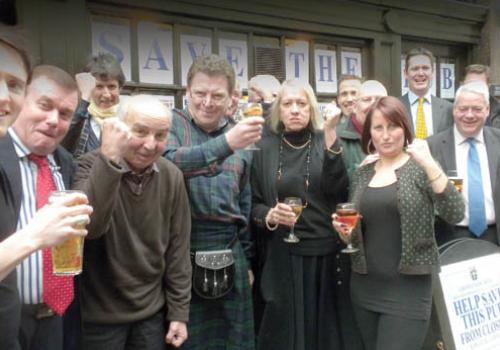 Publicans Rosemary John and Alan Weavis with staff and Grosvenor regulars