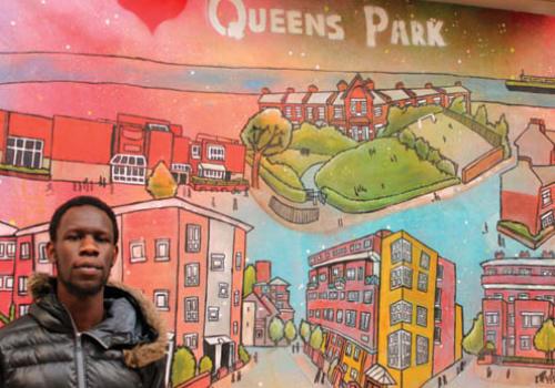 Queen’s Park scene: artist Brian Okello with his mural 